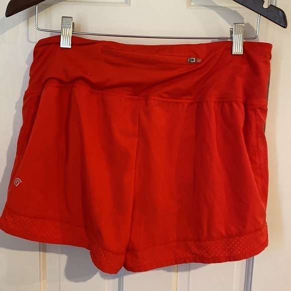 Red champion athletic shorts with built in undies. Size L - Picture 3 of 5